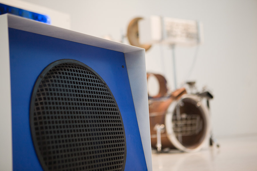 #UNRAVEL Speaker with Percussion Set in background